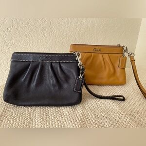 Two Coach wristlets